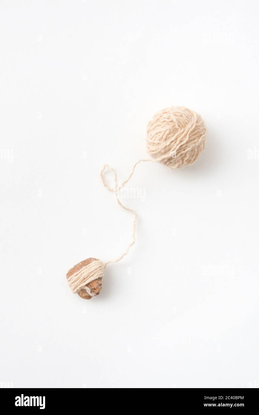 Ball of natural woolen thread on a white background. Top view Stock ...
