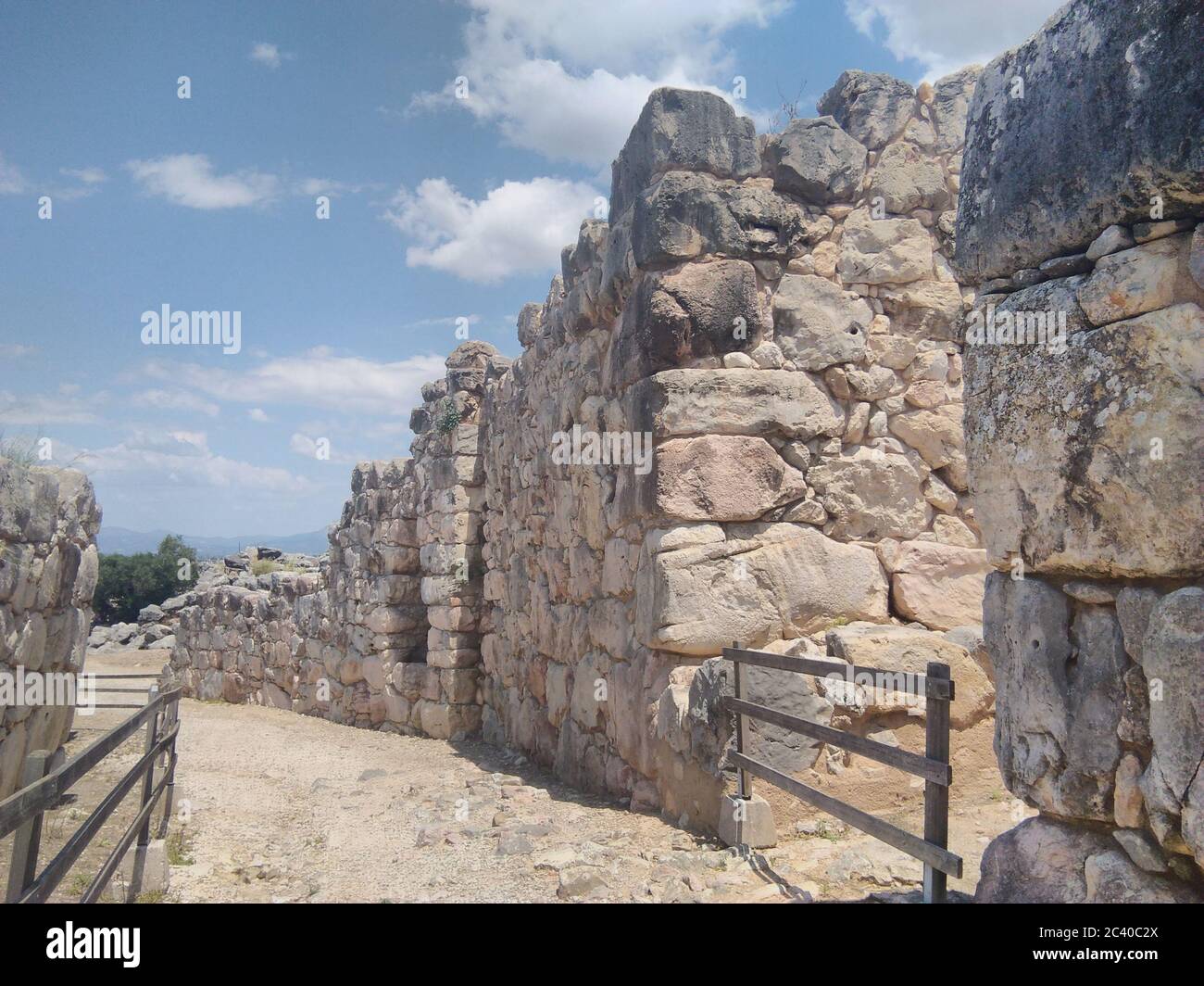 The ancient Greek city of Tiryns, in Argolis in the Peloponnese. A  Mycenaean archaeological site. An ancient hill fort and it's defensive walls. Stock Photo