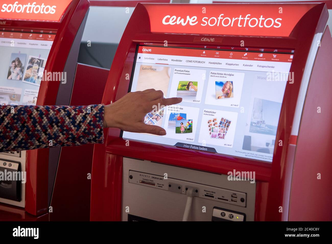Oldenburg, Germany. 20th May, 2020. Instant photos are ordered at a vending machine from the photo service provider Cewe. Credit: Sina Schuldt/dpa/Alamy Live News Stock Photo