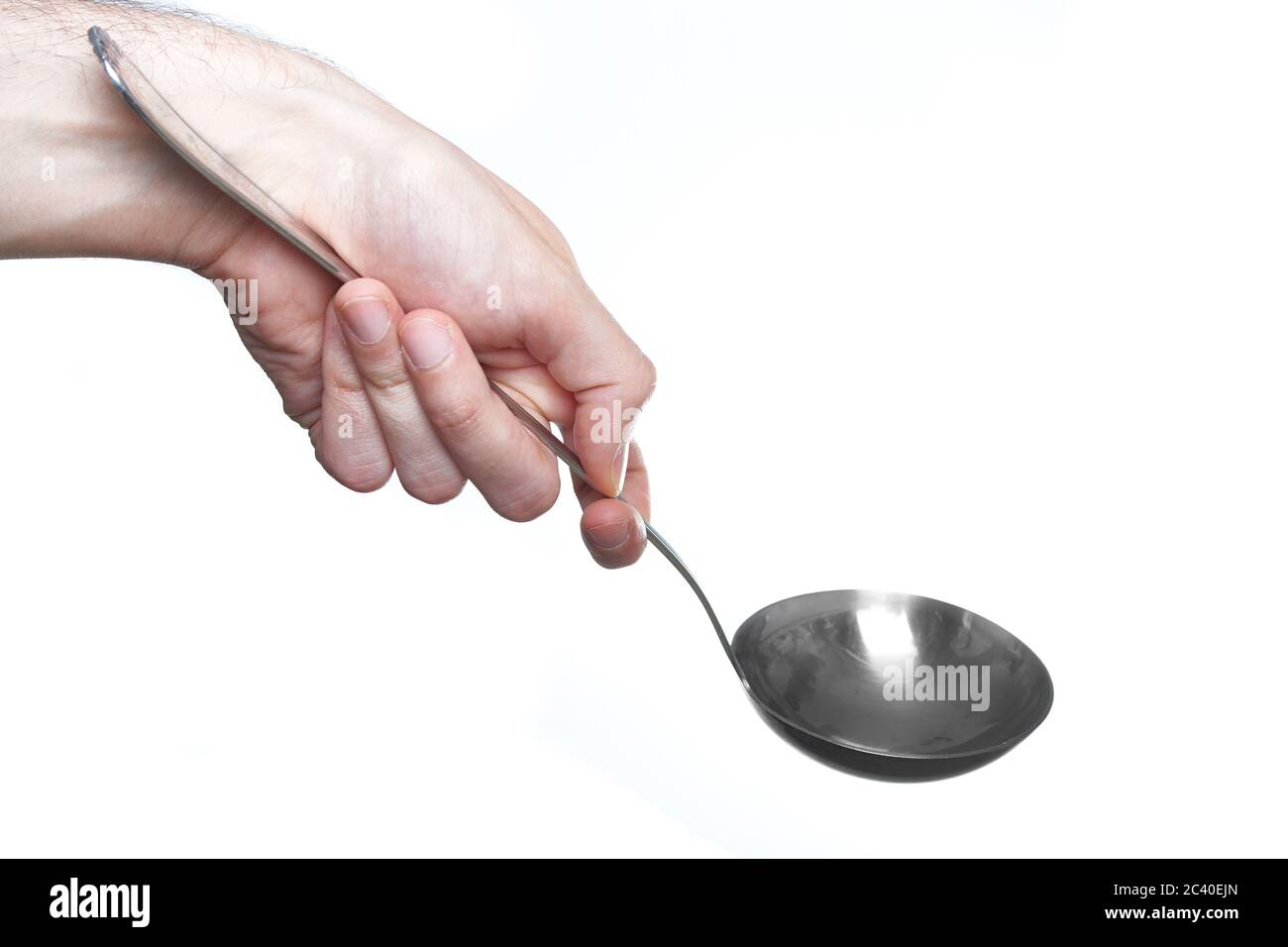 man hand holding soup ladle isolated on white background Stock Photo - Alamy