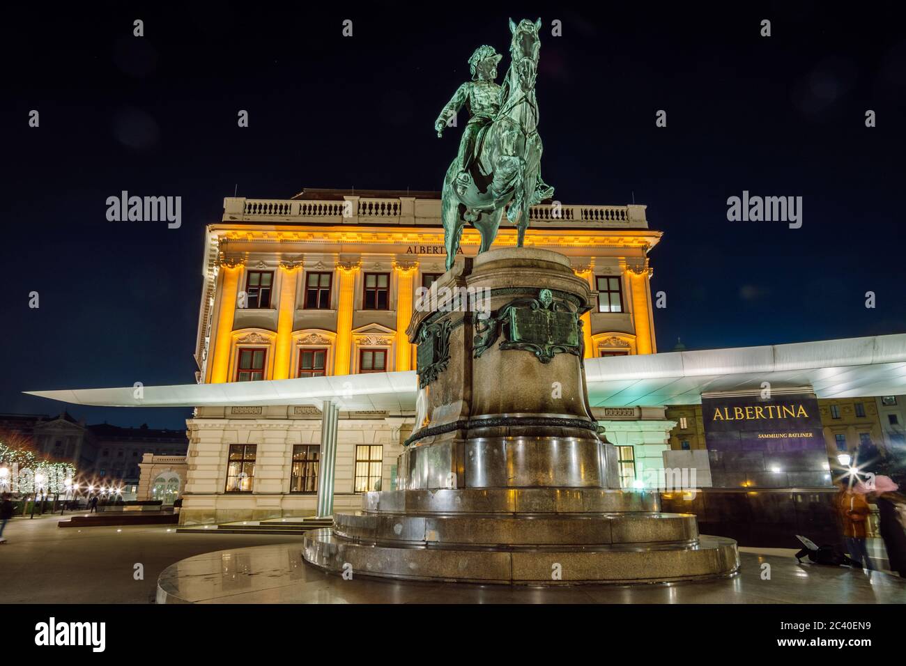 Night view of the Albertina Museum, Vienna. Equestrian statue of Archduke Albert in front of the Albertina Museum at night, Vienna, Austria. Stock Photo
