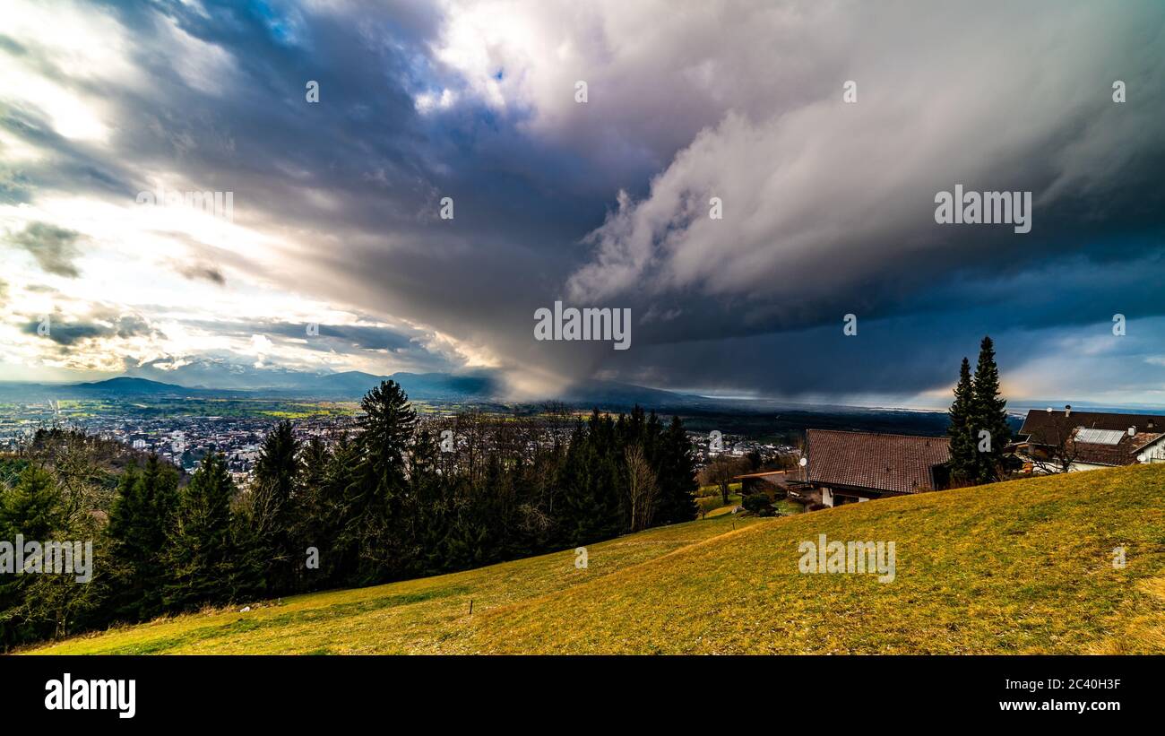 Eindrückliche Wetterstimmung über dem Rheintal, Spotlight in the valley of Rhein, Thundercloud and sunlight, Vorarlberg, Austria Stock Photo
