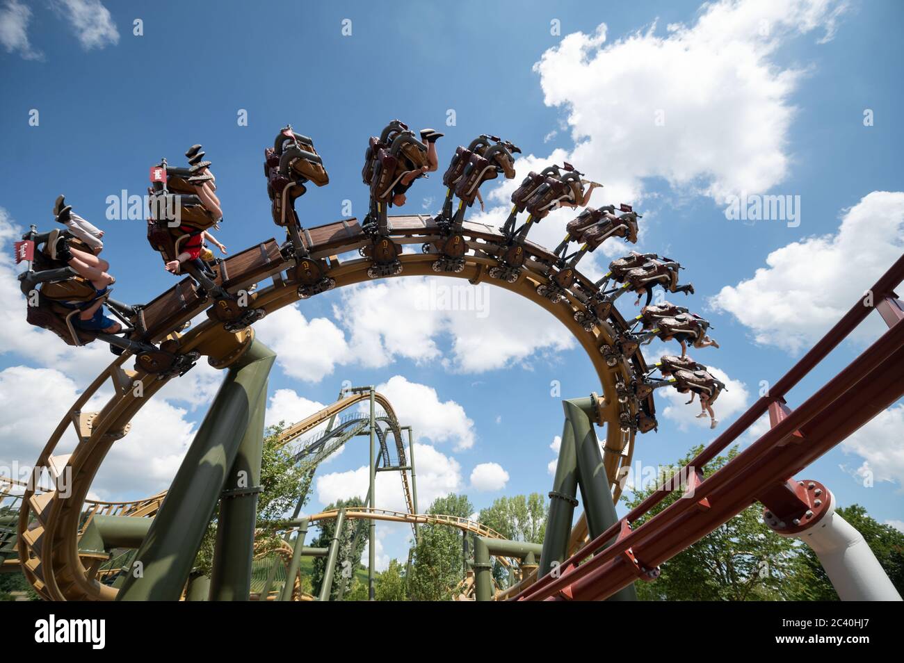 Cleebronn, Germany. 23rd June, 2020. Visitors of the opening event for the  inauguration of two new roller coasters at the Tripsdrill adventure park  ride the roller coaster "neck and neck". For the
