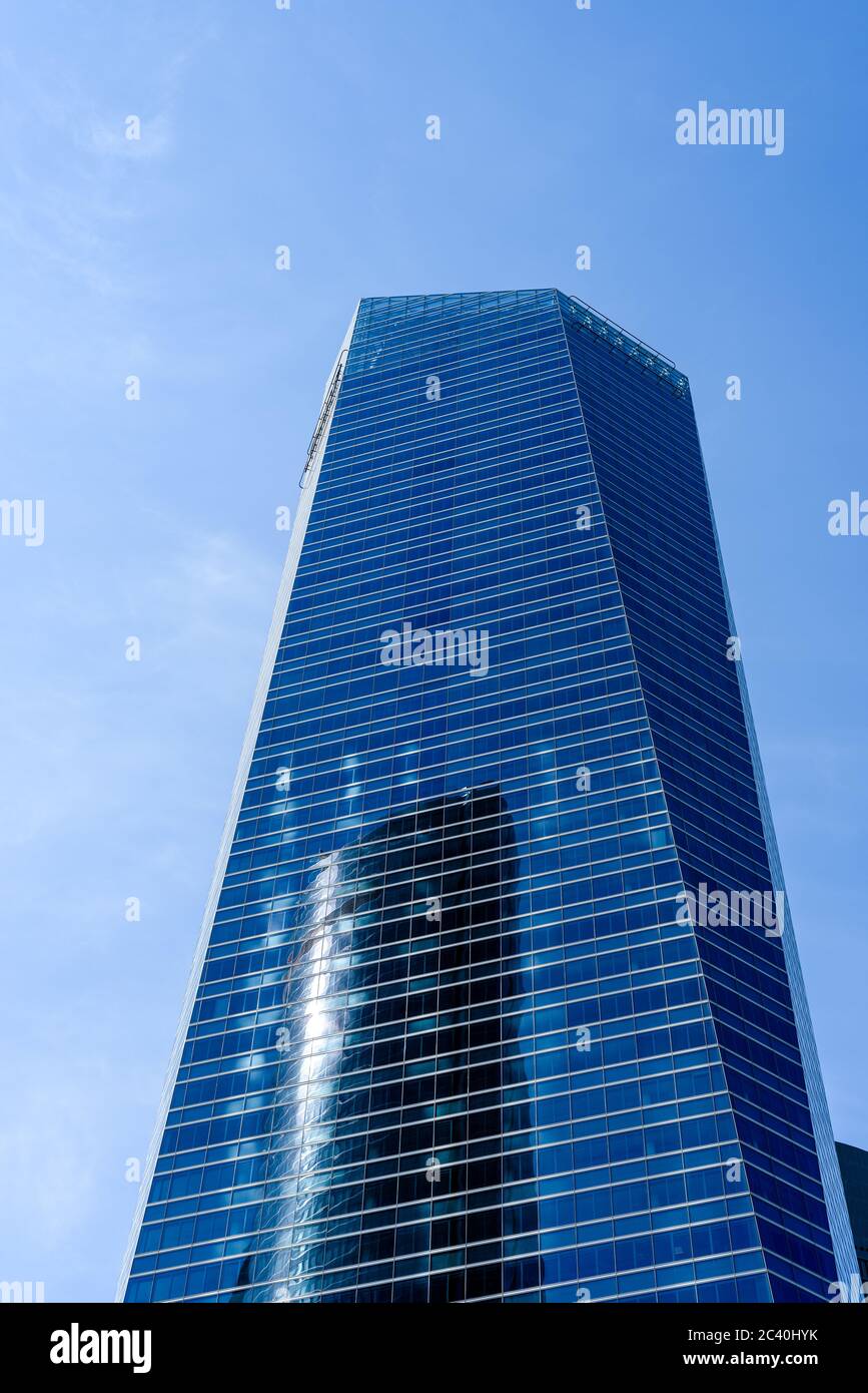 Madrid, Spain - June 14, 2020: Skyscraper against blue sky in Four Towers Business Area. Torre de Cristal Stock Photo