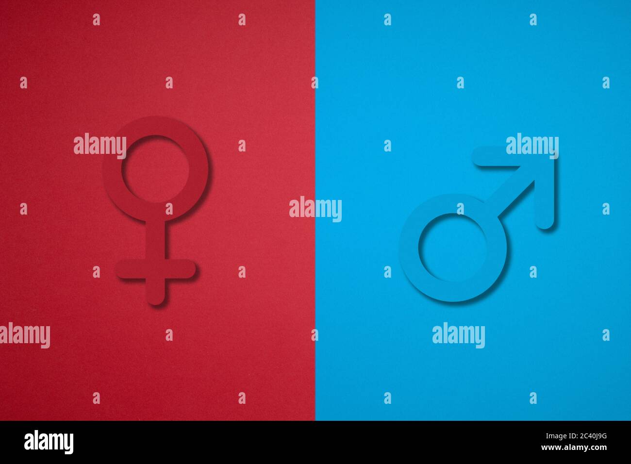 male and female gender symbols made by cutting paper. Stock Photo