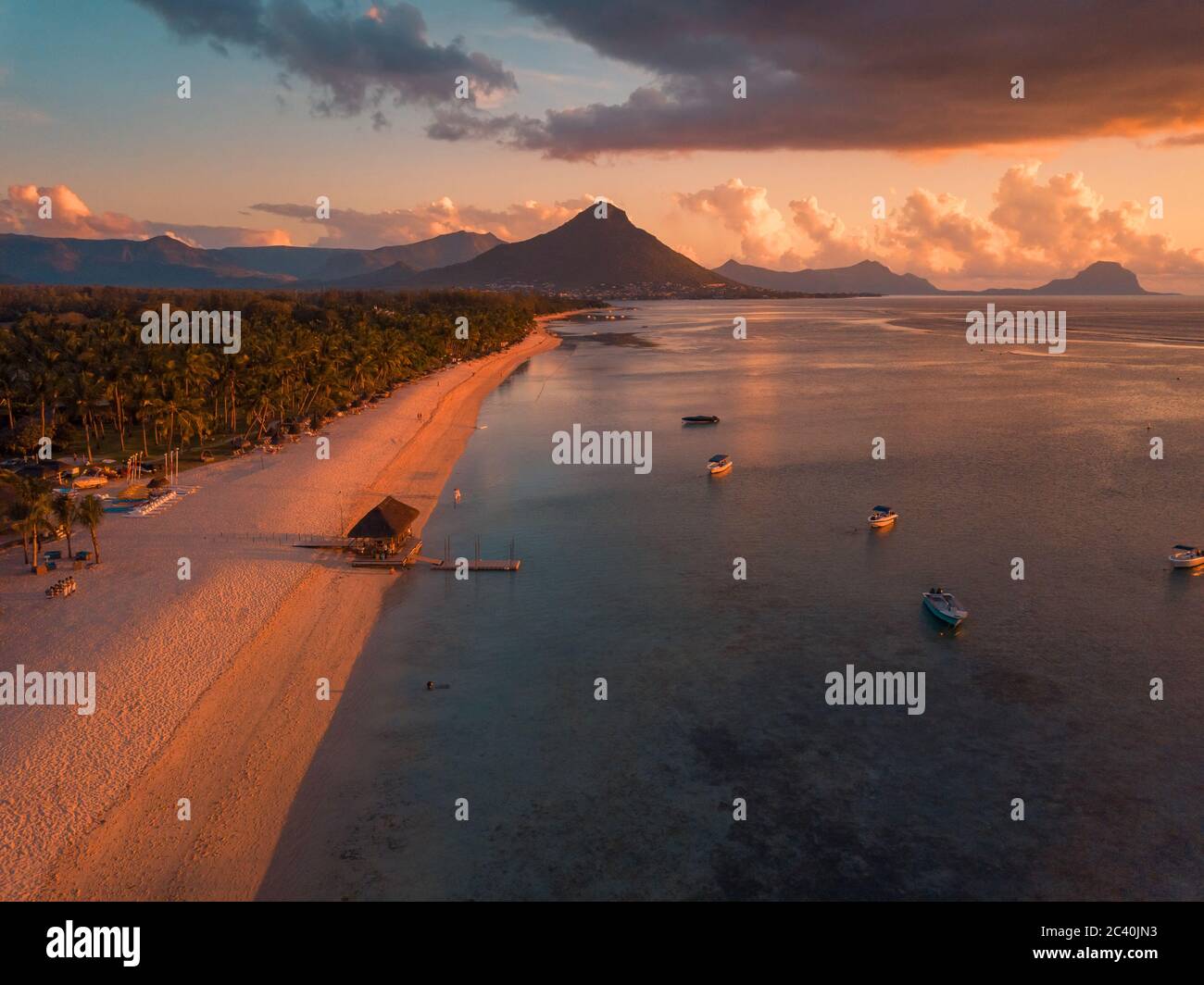 Aerial view of Flic and Flac, Mauritius in sunset light. Exotic beach