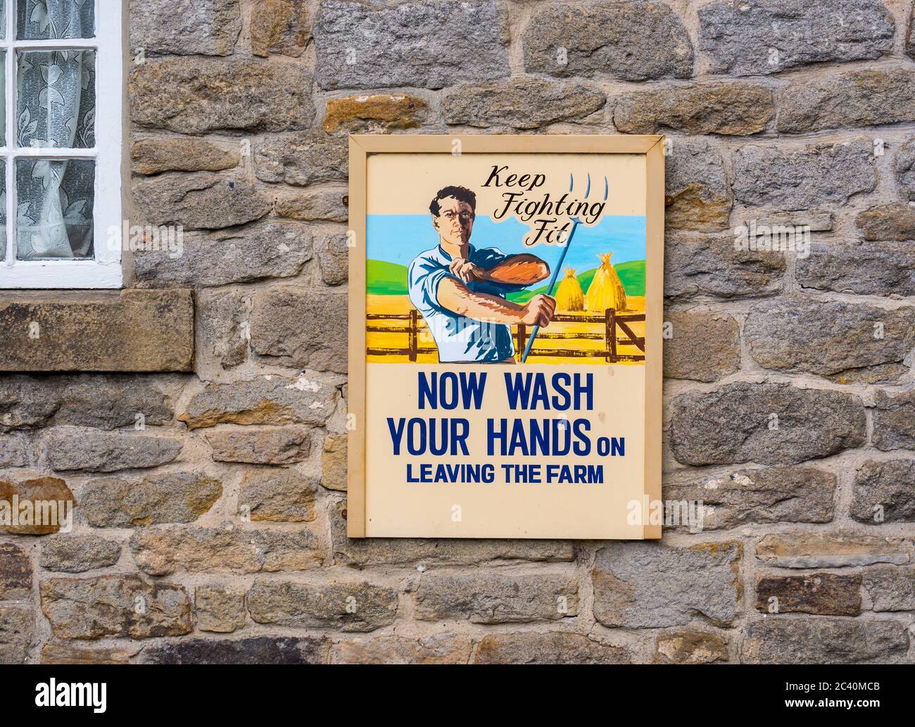 Old fashioned vintage wartime sign to remember to wash your hands and keep fighting fit, England, UK Stock Photo
