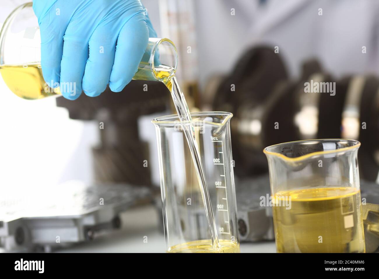 Man hands doing chemistry test of motor oil Stock Photo Alamy