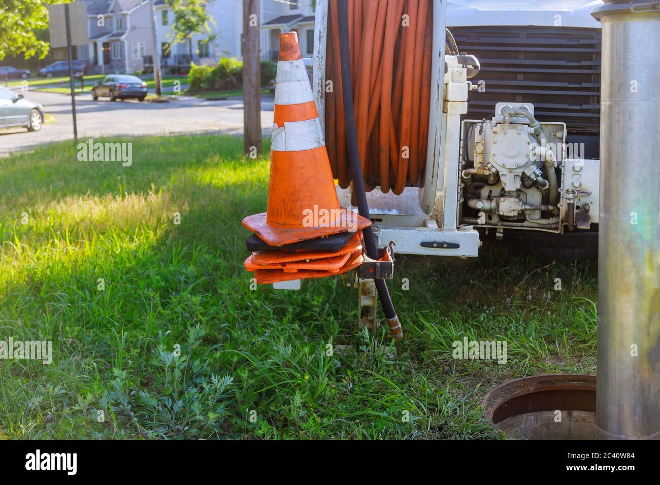 Machine for for cleaning blocked drains sewer wells in the a town street. Stock Photo