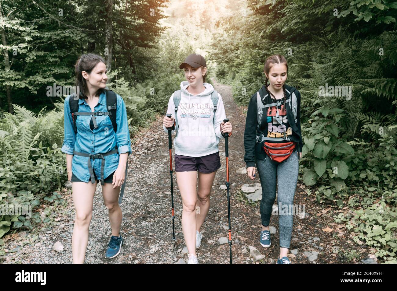 .women hikers on the trail Stock Photo