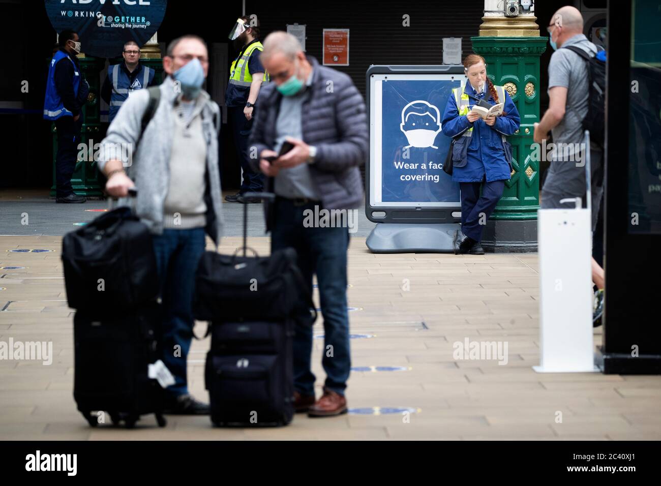 Staff and members of the public wear protective face masks inside