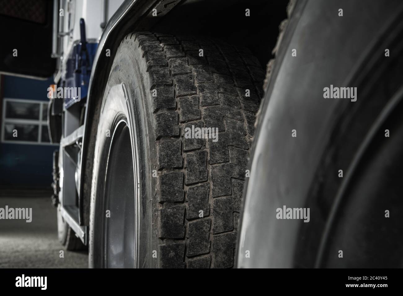 Heavy Duty Transportation Safety. Semi Truck Used Tire Tread Close Up. Transportation Theme. Stock Photo