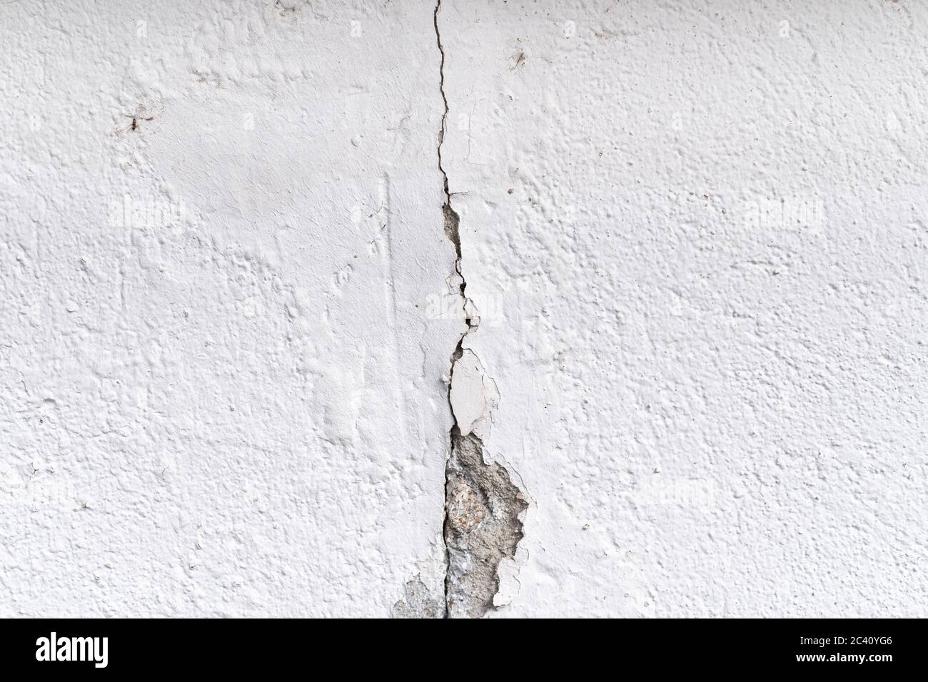 Cracked wall . Plaster and paint clog, structural damage, water damage