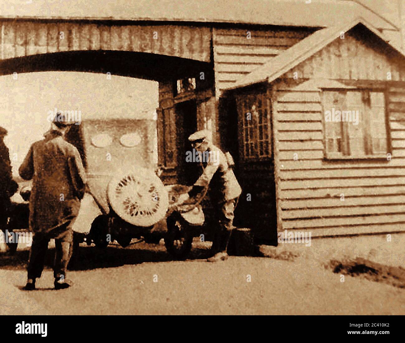 The first motorist's filling station in England was officially opened in November 1919 at Aldermaston, Berkshire by the Automobile Association (AA) to promote  British-made coal-based  benzole fuel  as opposed to Russian Petrol. It was sold at cost price to members of the AA. The single hand-operated pump, was operated by an AA patrolmen in full uniform. The unmarked site is now in a  lay-by on the A4 Bath Road, Stock Photo