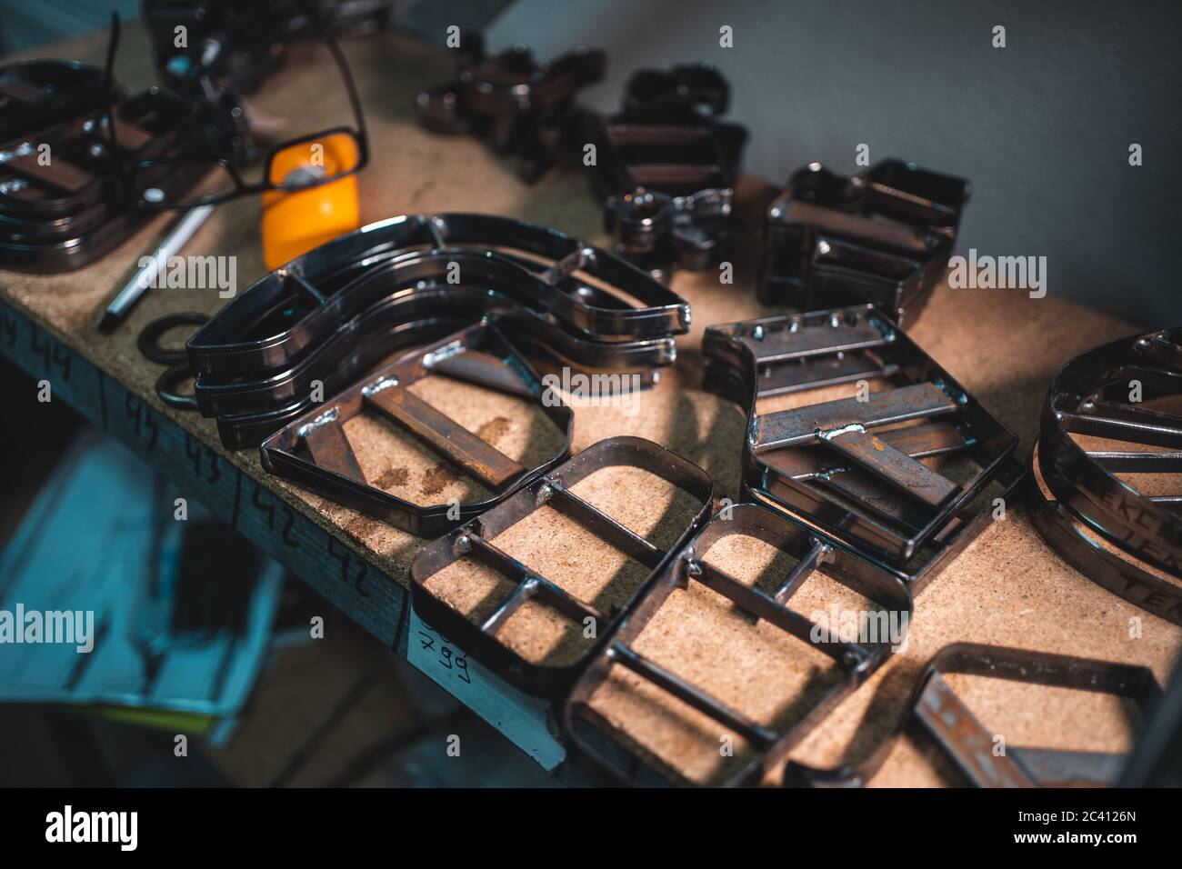 people working with press machinery for cutting shoe leather Stock Photo