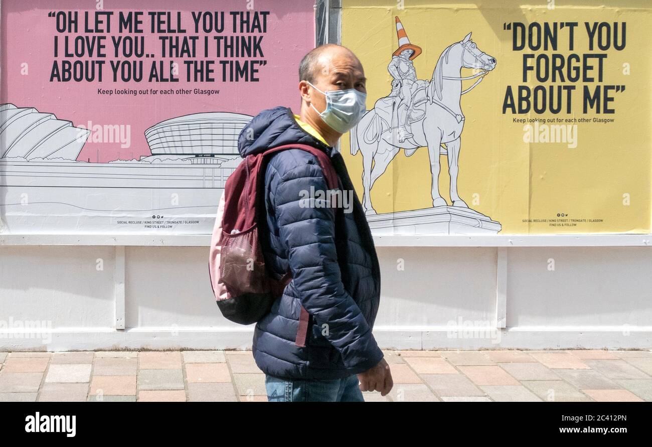 Posters with the message 'keep looking out for each other Glasgow' and featuring song lyrics by Scottish artists such as Simple Minds, Dougie MacLean and Stealers Wheel have appeared around Glasgow city centre. Stock Photo