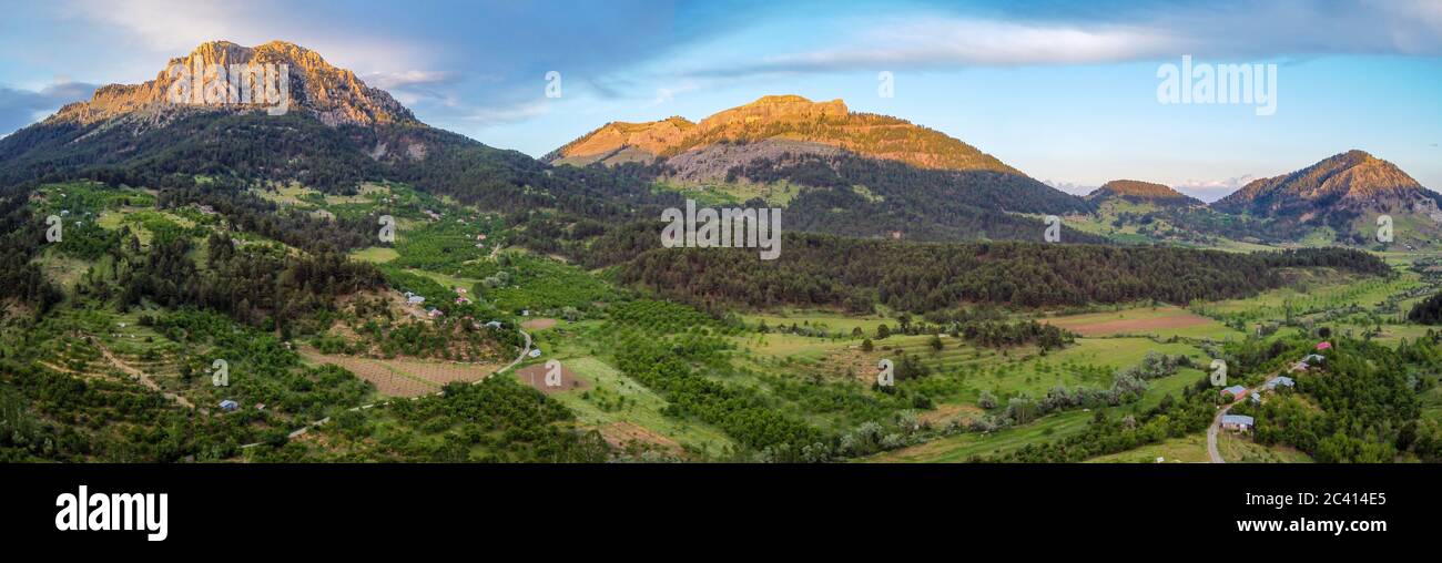 A bird's-eye view of the small village in the magnificent nature. Drone view of village. Stock Photo