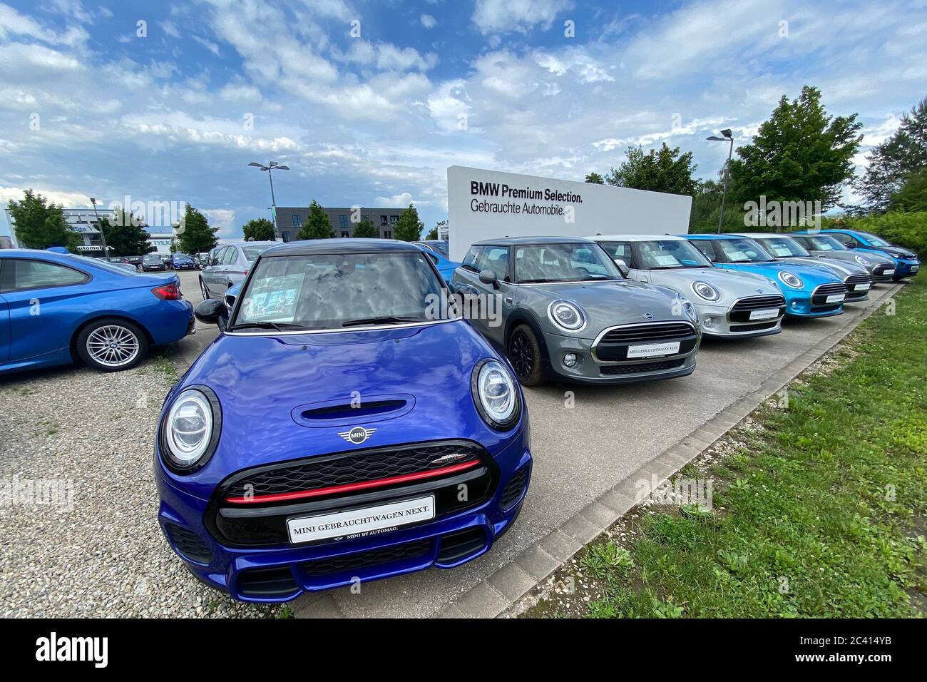 Munich, Deutschland. 21st June, 2020. BMW MINI dealership with oversupply  of new cars. BMW and MINI automobiles are on a heap and are waiting for  customers. Auto sales are slumping worldwide due