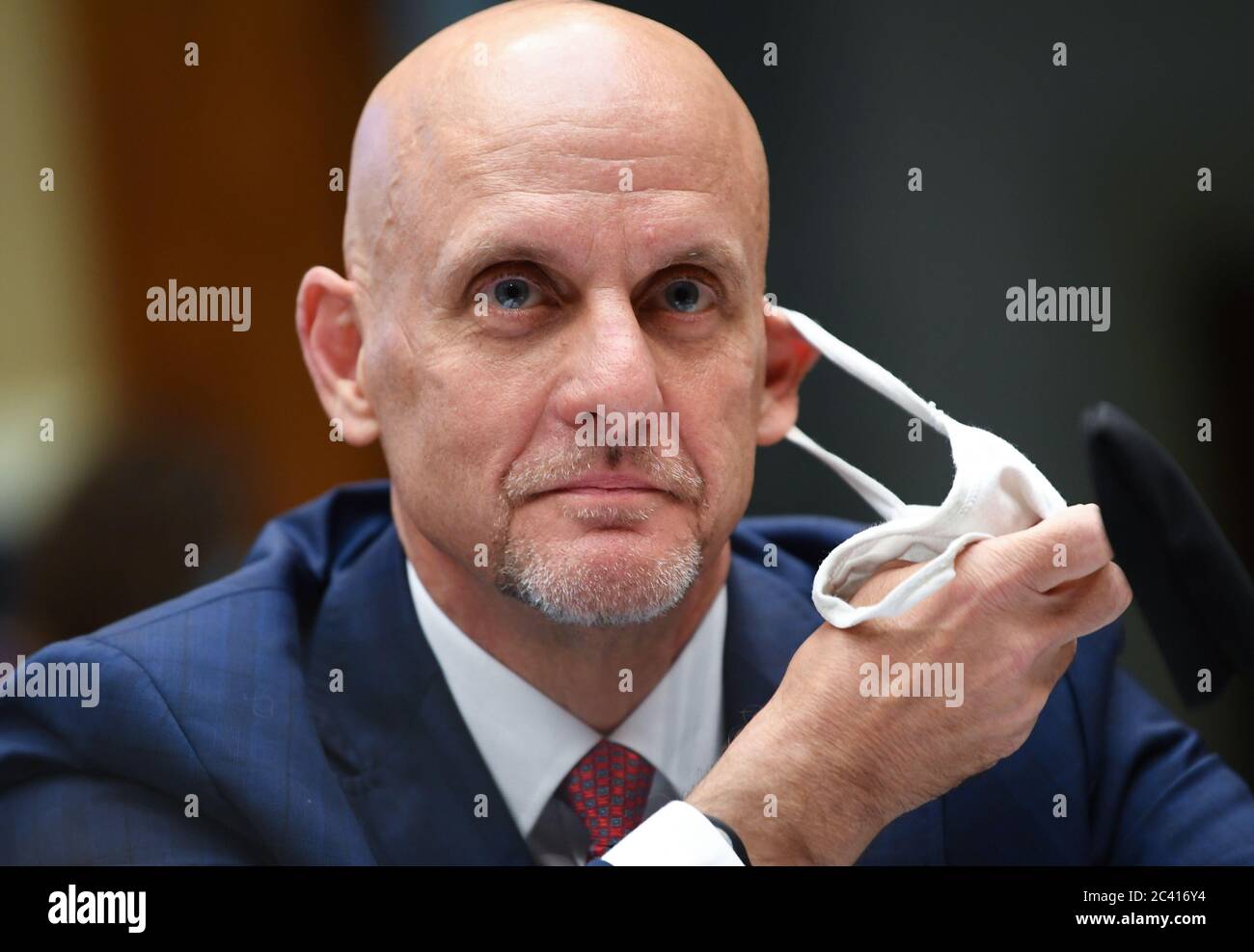 Washington, United States. 23rd June, 2020. Commissioner of U.S. Food and Drug Administration Dr. Stephen M. Hahn removes his face mask to testify before the House Committee on Energy and Commerce on the Trump Administration's Response to the COVID-19 Pandemic, on Capitol Hill in Washington, DC on Tuesday, June 23, 2020. Photo by Kevin Dietsch/UPI Credit: UPI/Alamy Live News Stock Photo