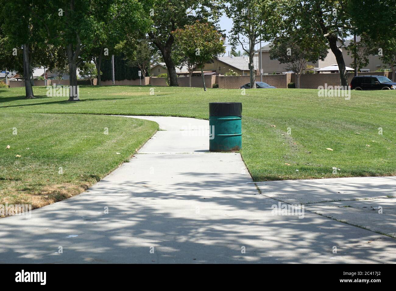 Trash Barrel in a City Park Stock Photo
