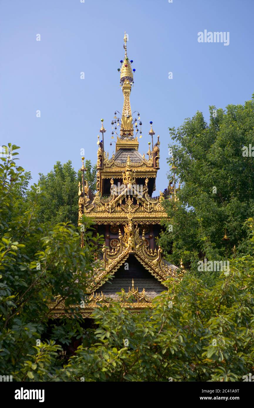 Roof of a building between trees, hotel complex Stock Photo - Alamy