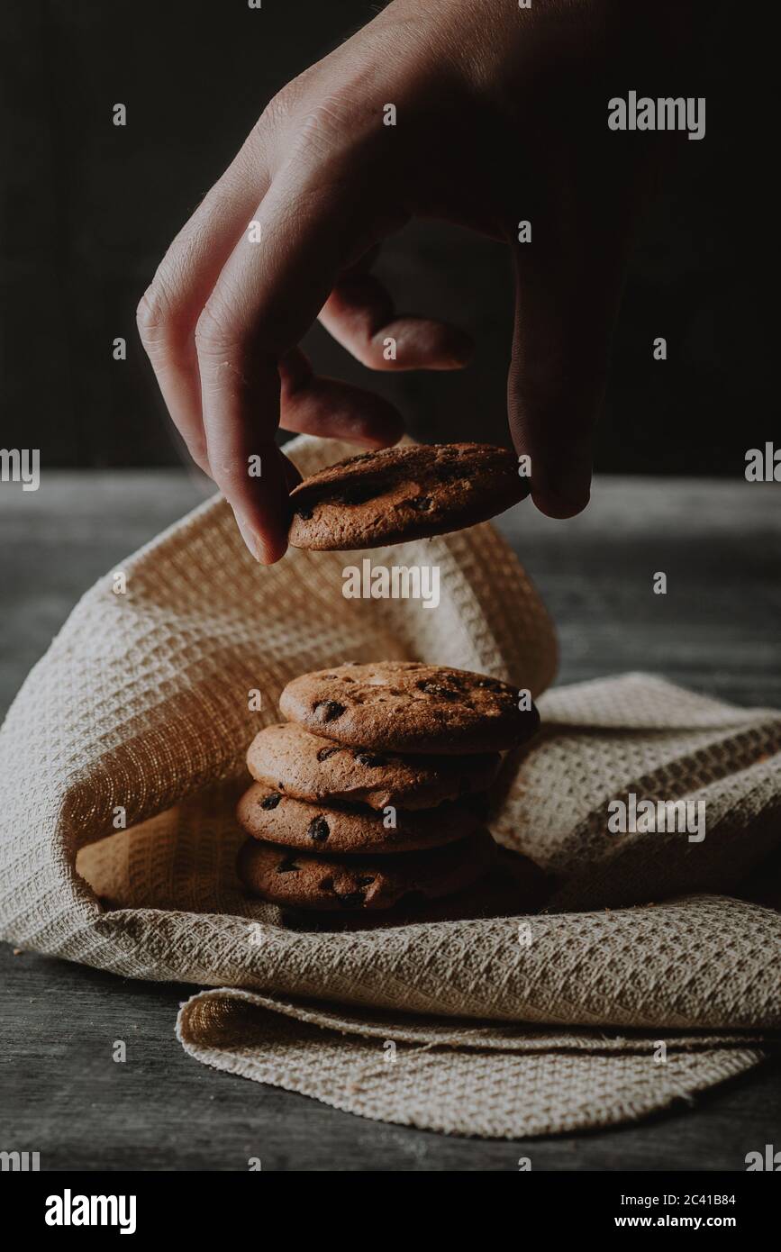 chocolate chip cookies dark food photography Stock Photo - Alamy, image size:867x1390