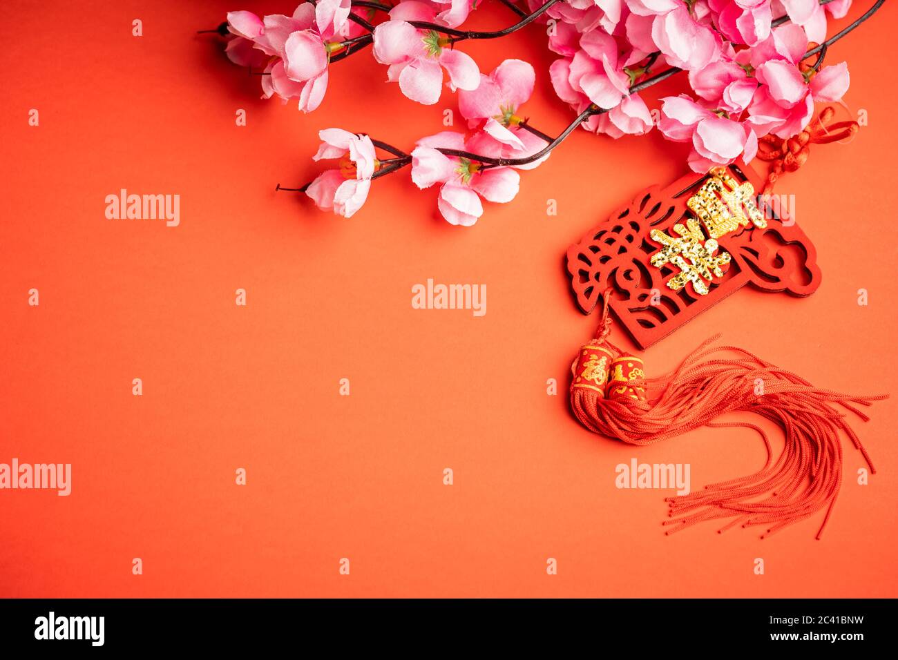Chinese New Year background. Chinese ornaments and pink flower. The