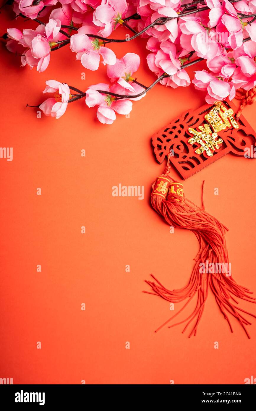 Chinese New Year background. Chinese ornaments and pink flower. The