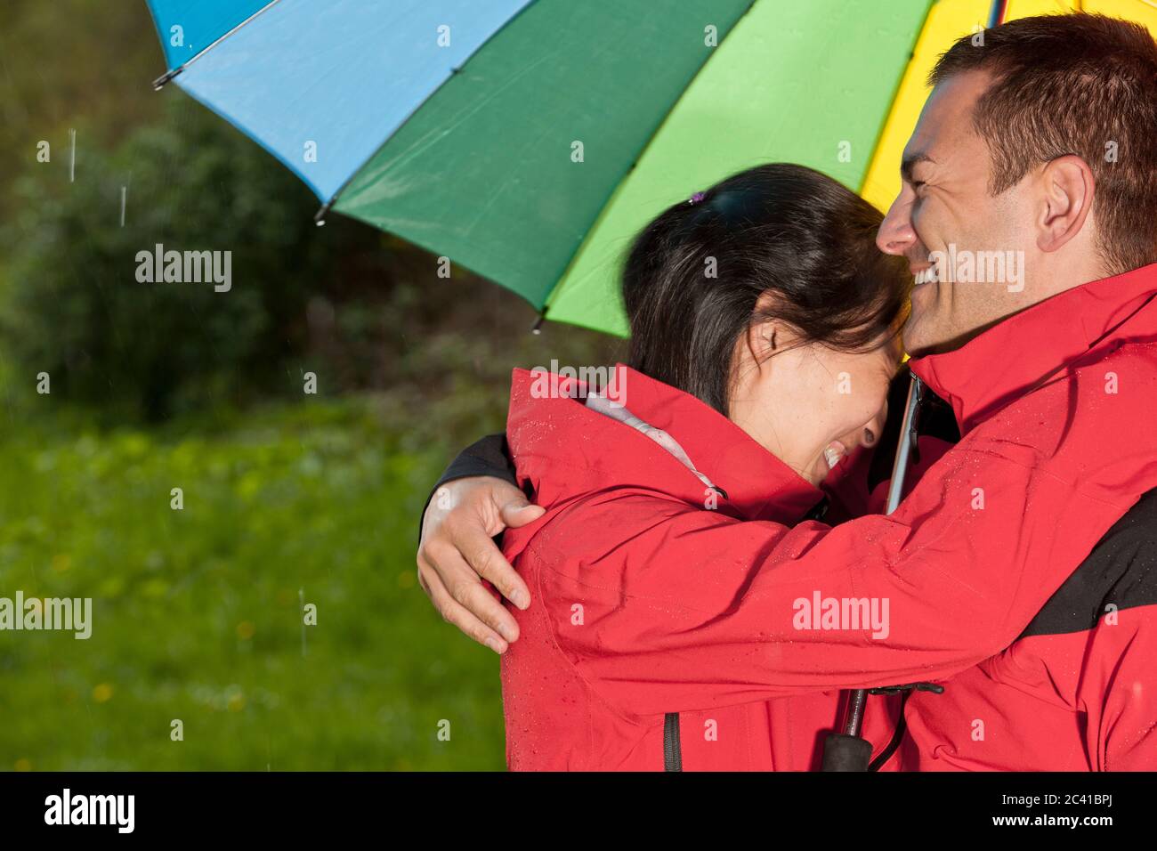 couple enjoying a walk in the rain in England Stock Photo