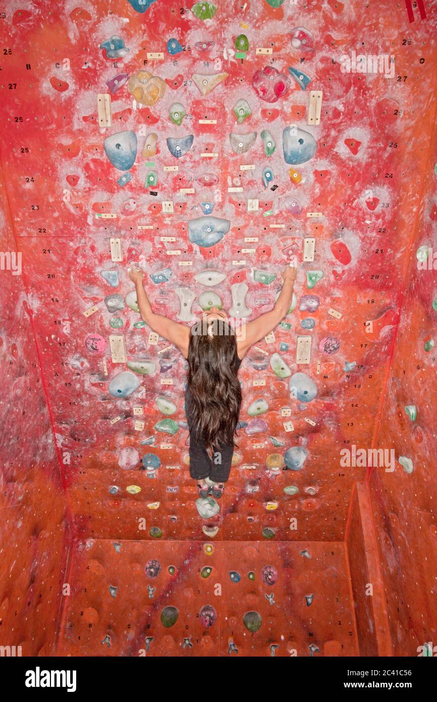 woman bouldering at indoor climbing gym Stock Photo Alamy