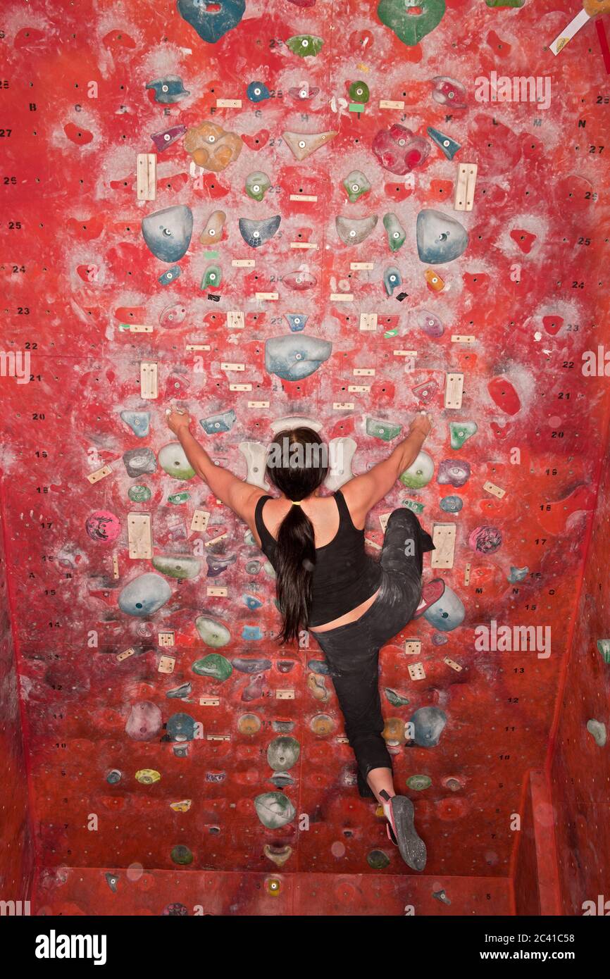 woman bouldering at indoor climbing gym Stock Photo Alamy