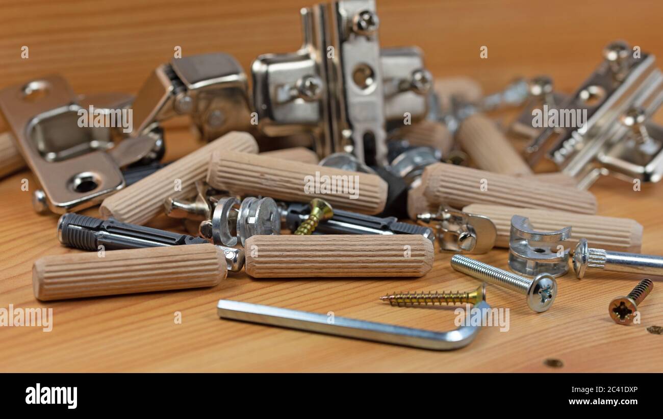 Various furniture fittings and assembly utensils in a closeup Stock
