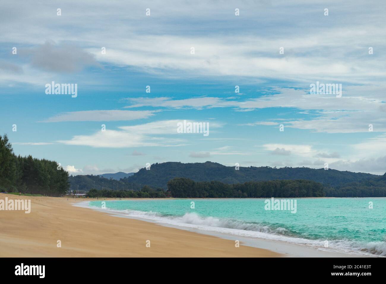 sand sea beach with pine tree and mountain, blue sky background Stock ...
