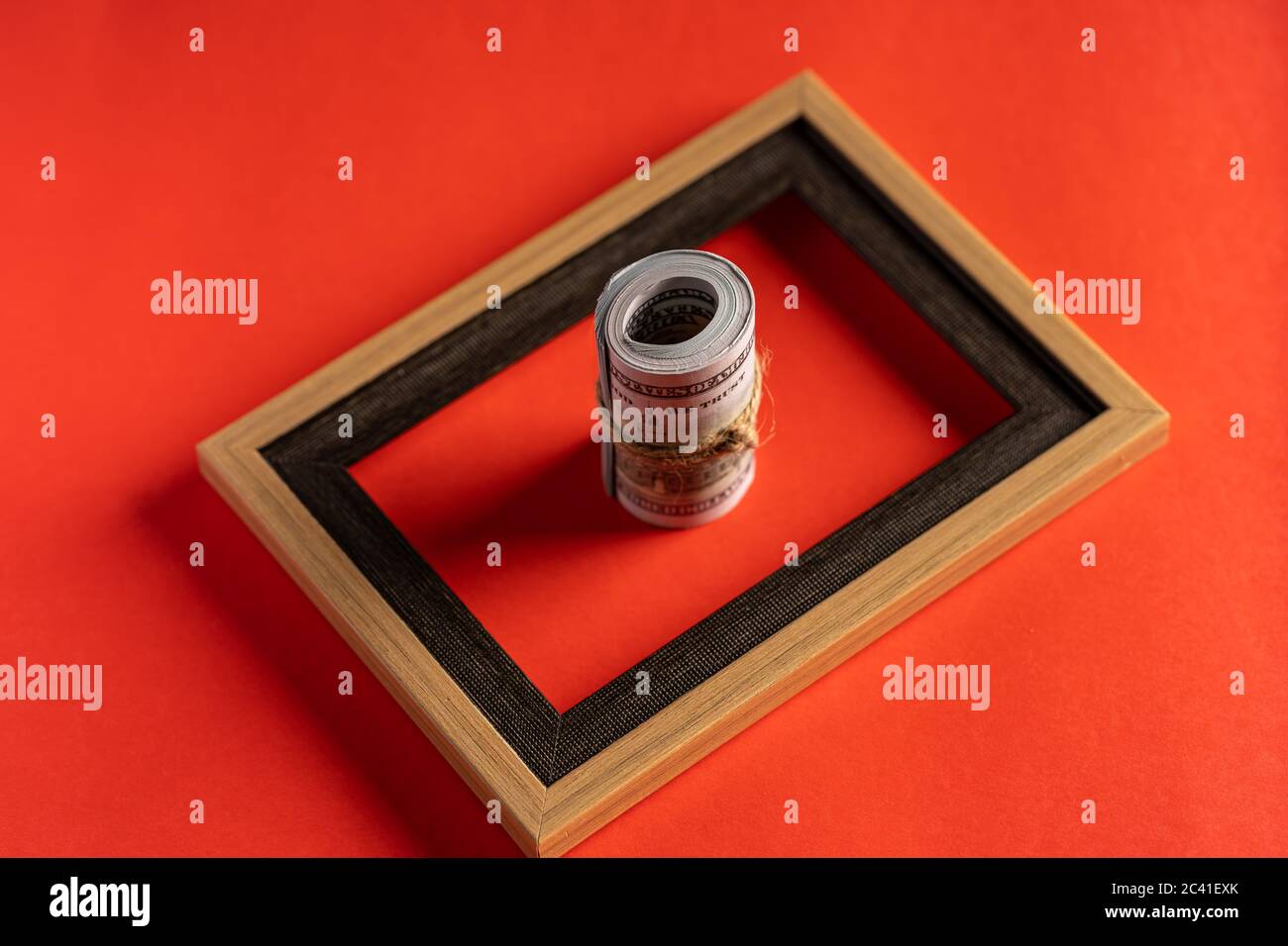 US dollar bills against red background Stock Photo