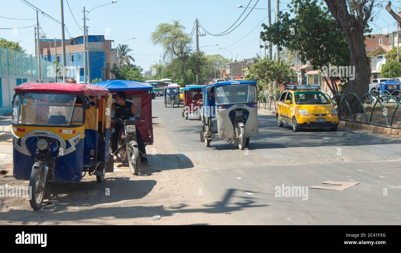 San Miguel de Piura, Piura / Peru - April 5 2019: Daily activity on a congested street with many mototaxis circulating Stock Photo