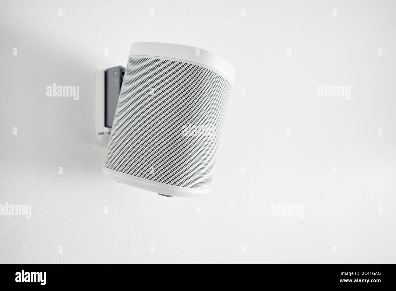 Wall mounted audio speaker on a white background. Stock Photo