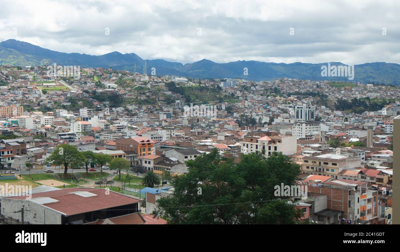 Panoramic view of the city of Loja in Ecuador with mountains on the horizon on a cloudy afternoon Stock Photo