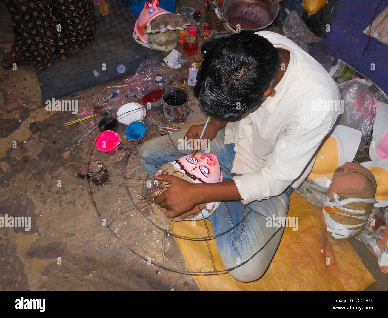 mask maker of purulia busy with his work Stock Photo