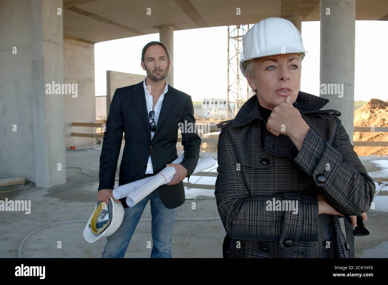 Two architects stand on a construction site Stock Photo - Alamy
