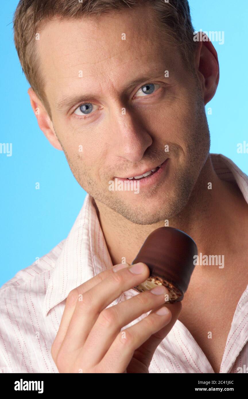 Young man with a moor's head candy Stock Photo Alamy