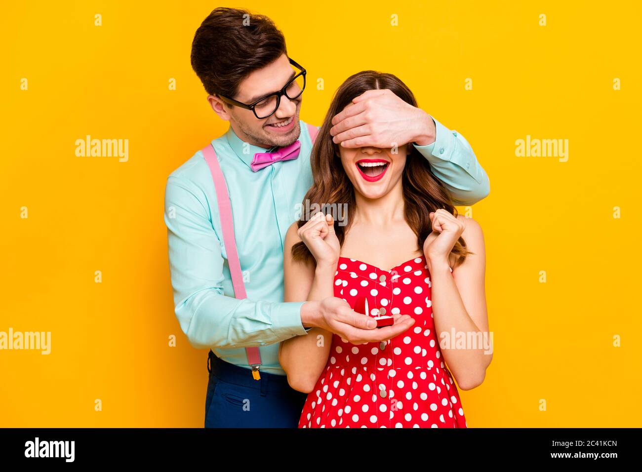 Two people crazy overjoyed girl man hide her eyes give jewelry ring ask ...