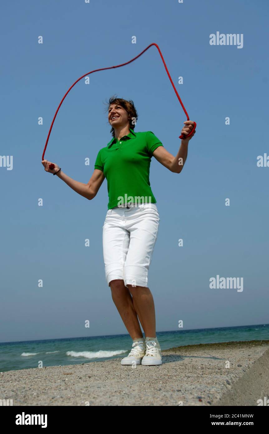 Woman jumps rope hi-res stock photography and images - Alamy
