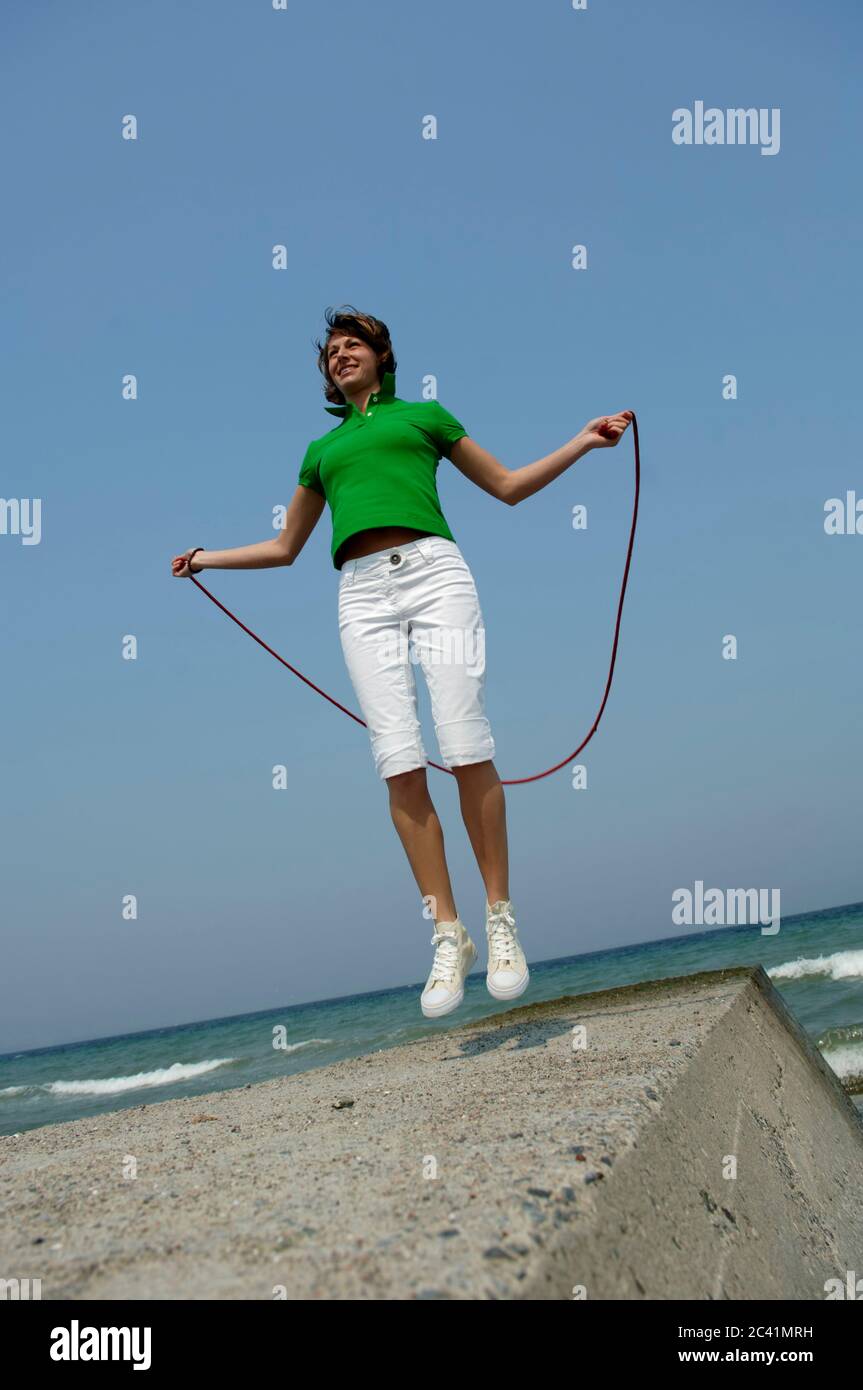 Woman jumps rope hi-res stock photography and images - Alamy