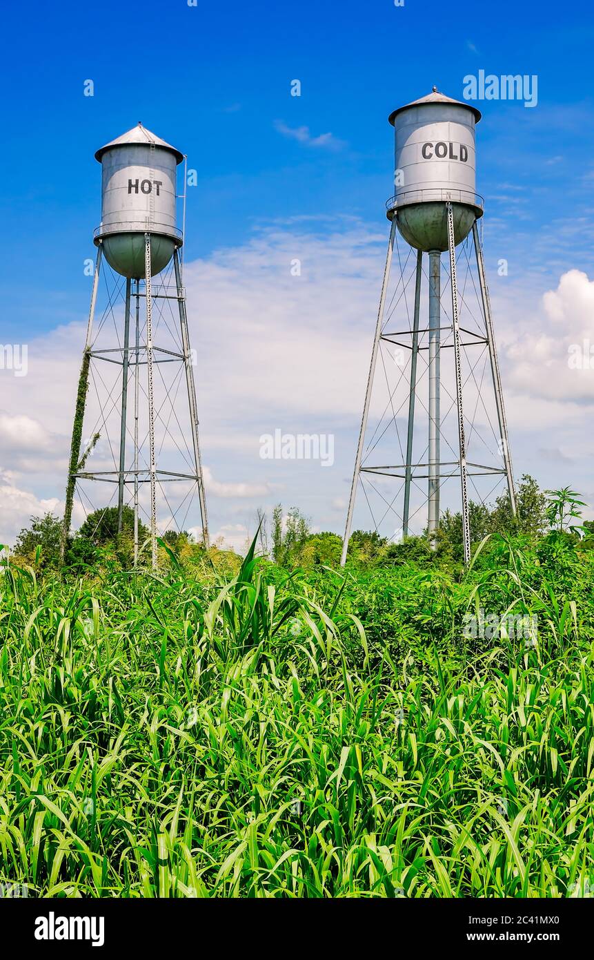 “Hot” and “Cold” water towers are sidebyside in a field, Aug. 1, 2016, in Ruleville