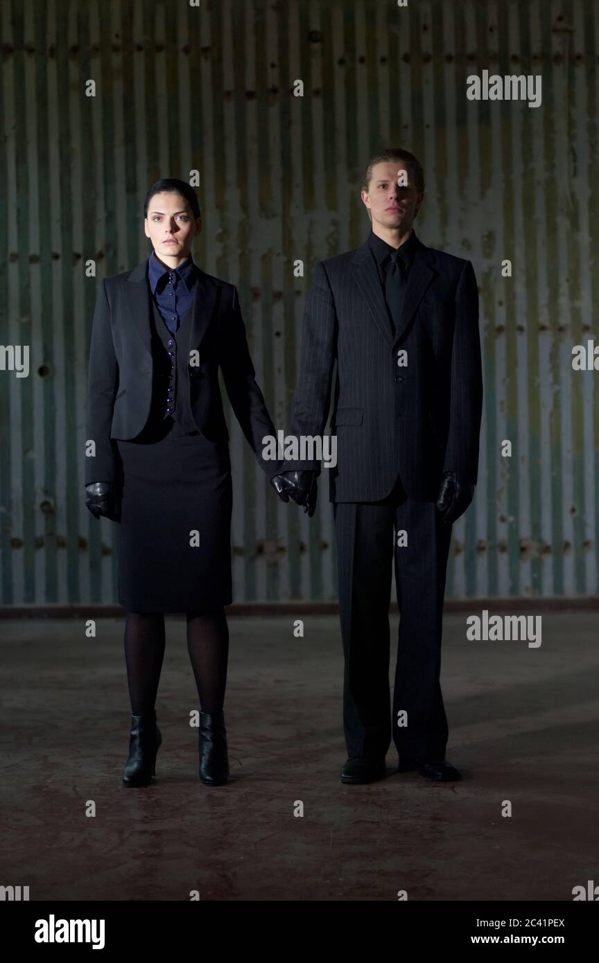 Black clad man hi-res stock photography and images - Alamy