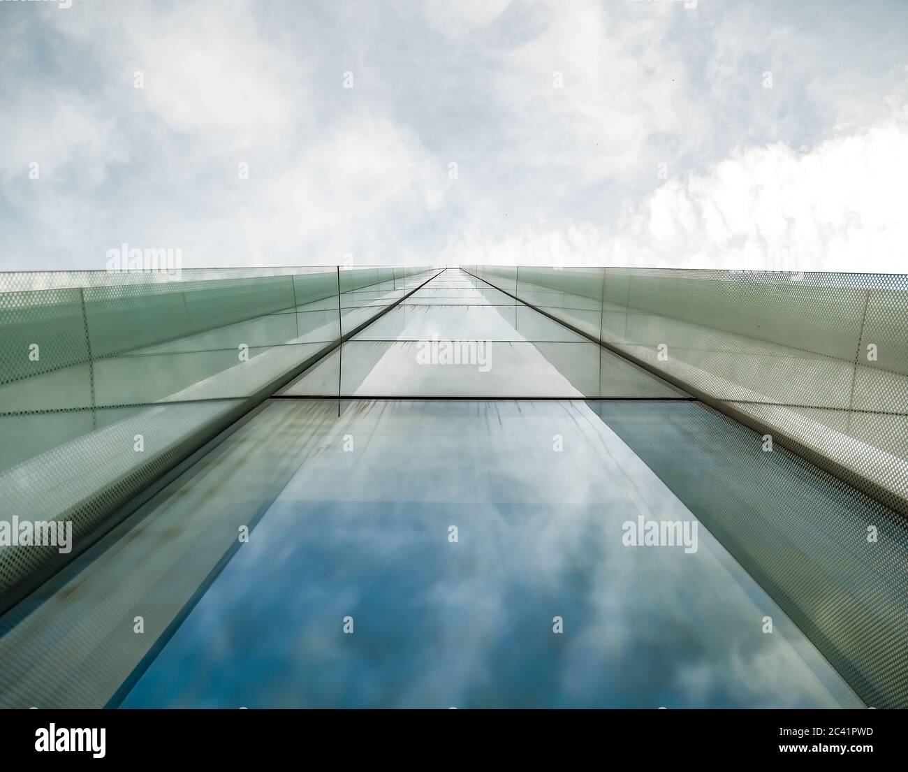 Modern glass office building agaist the cloudy sky Stock Photo - Alamy