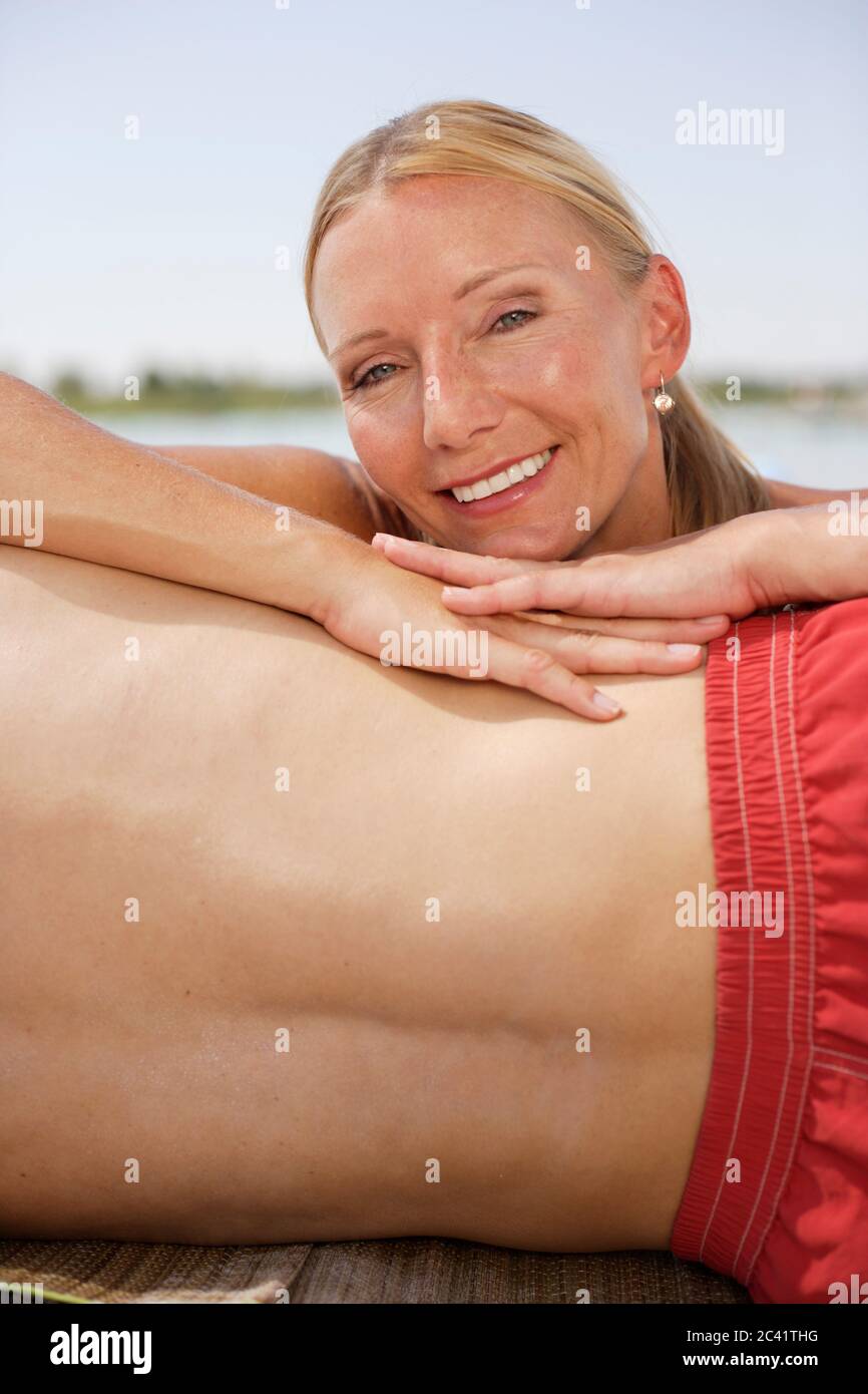 Woman smiles at the camera Stock Photo - Alamy