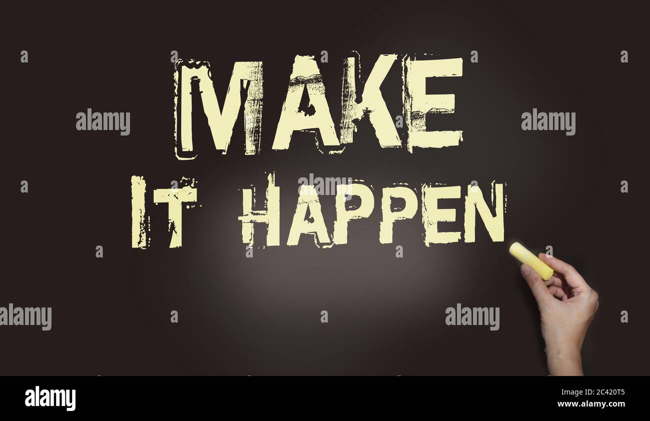 Make It Happen written in chalk on a used blackboard. Used in business, life and sports coaching this well known phrase or saying has become a Stock Photo