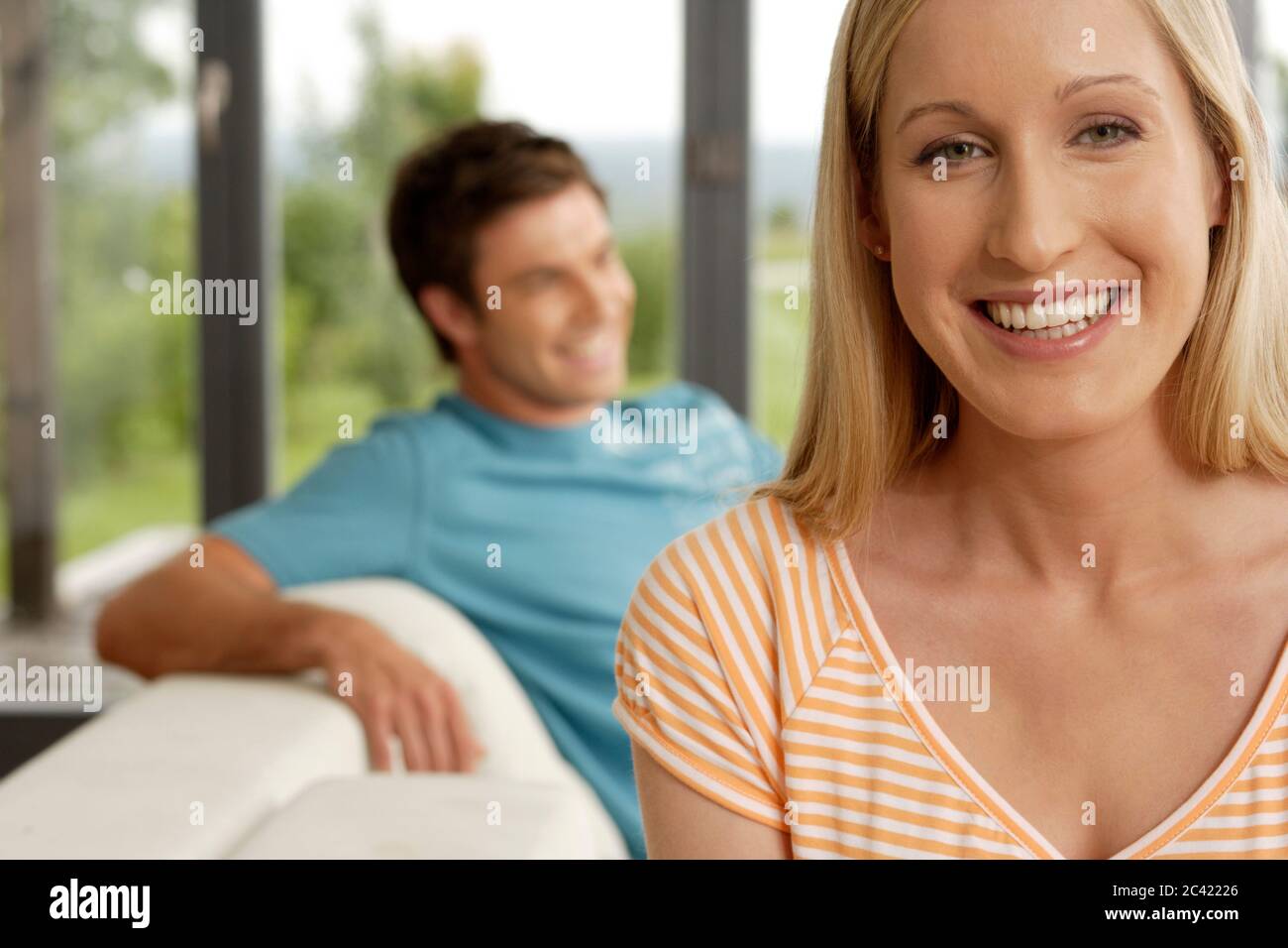 Blond woman man sitting hi-res stock photography and images - Alamy