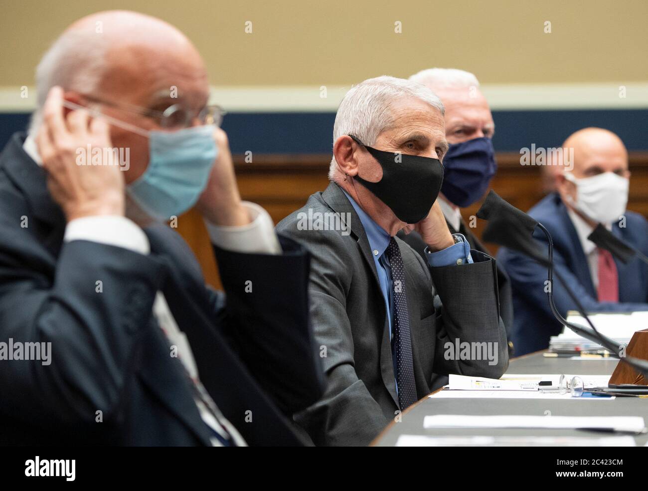 From left to right, Dr. Robert Redfield, Director, Centers for Disease Control and Prevention; Dr. Anthony Fauci, Director, National Institute for Allergy and Infectious Diseases, National Institutes of Health; ADM Brett P. Giroir, Assistant Secretary for Health U.S. Department of Health and Human Services; and Dr. Stephen M. Hahn, Commissioner, U.S. Food and Drug Administration; testify during a House Energy and Commerce Committee hearing on the Trump Administration's Response to the COVID-19 Pandemic, on Capitol Hill in Washington, DC on Tuesday, June 23, 2020. Credit: Kevin Dietsch/Pool v Stock Photo